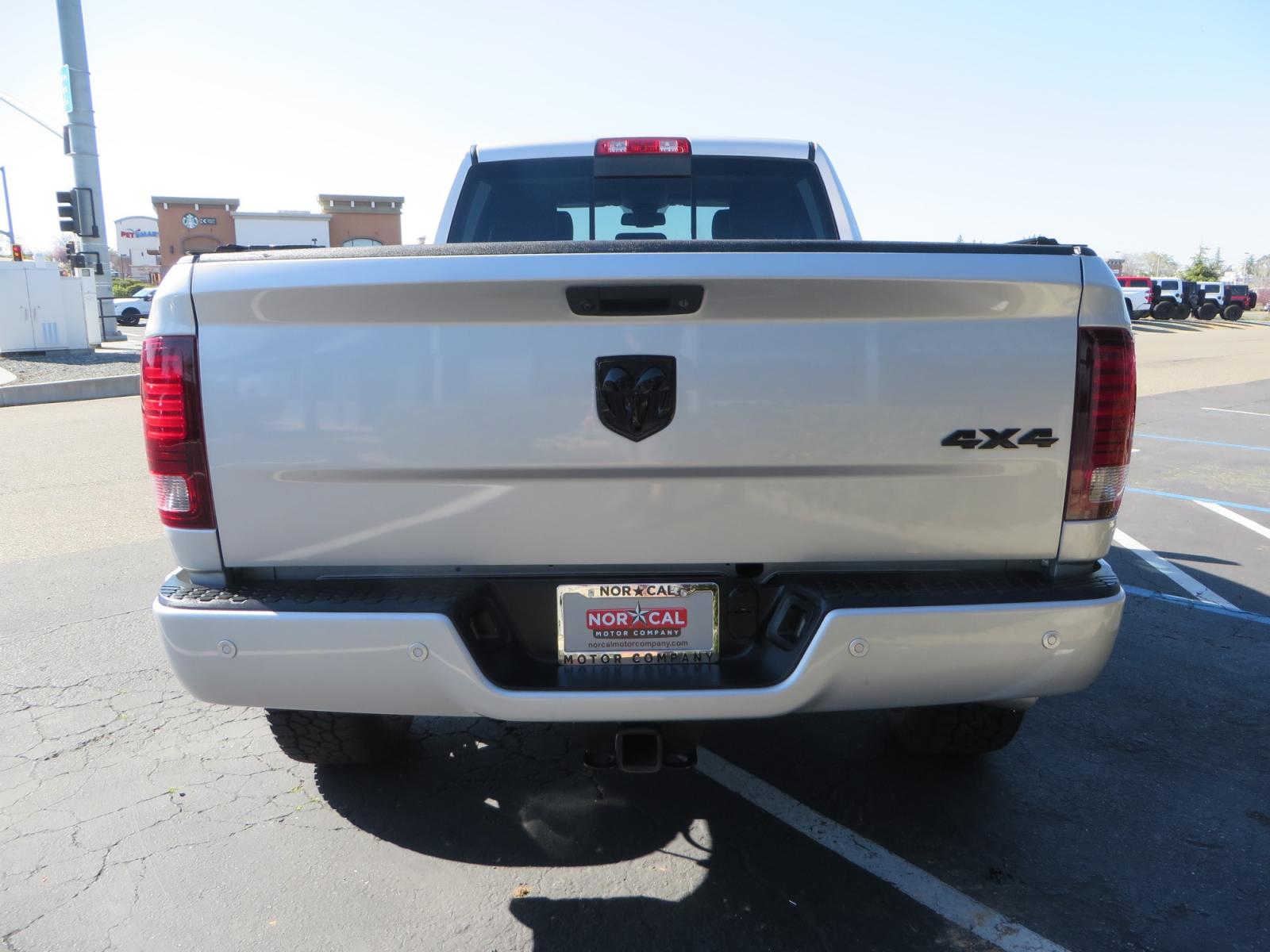 2016 SILVER /BLACK RAM 2500 Laramie Crew Cab SWB 4WD (3C6UR5FL3GG) with an 6.7L L6 OHV 24V TURBO DIESEL engine, 6A transmission, located at 2630 Grass Valley Highway, Auburn, CA, 95603, (530) 508-5100, 38.937893, -121.095482 - Leveled Ram sitting on Fuel Offroad wheels, Falken Wildpeak AT tires, Amp Power steps, Rolling Bed cover, Color matched fender flares, and window tint. - Photo #5